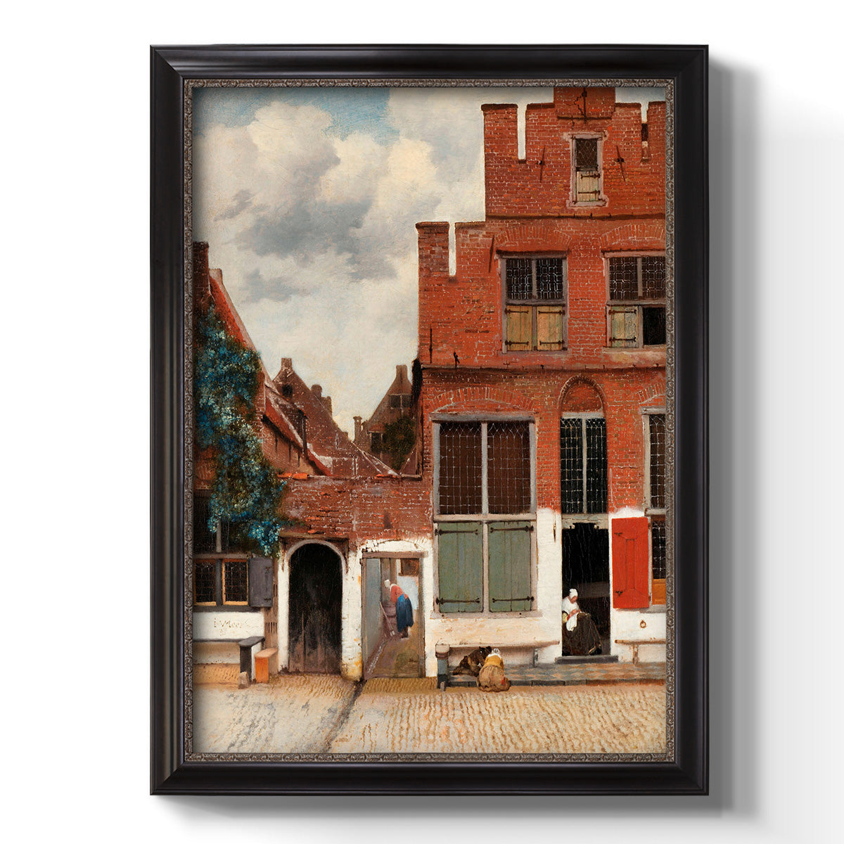 Realist city street scene by Johannes Vermeer printed on canvas in an ornate black frame with gilded inner detail with a vertical orientation.