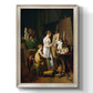 Classical interior painting of an artist at work by Louis-Leopold Boilly printed on canvas in an ornate black frame with gilded inner detail with a vertical orientation.
