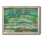 Impressionist garden scene with Japanese bridge and water lilies by Claude Monet printed on canvas in an ornate champagne frame.