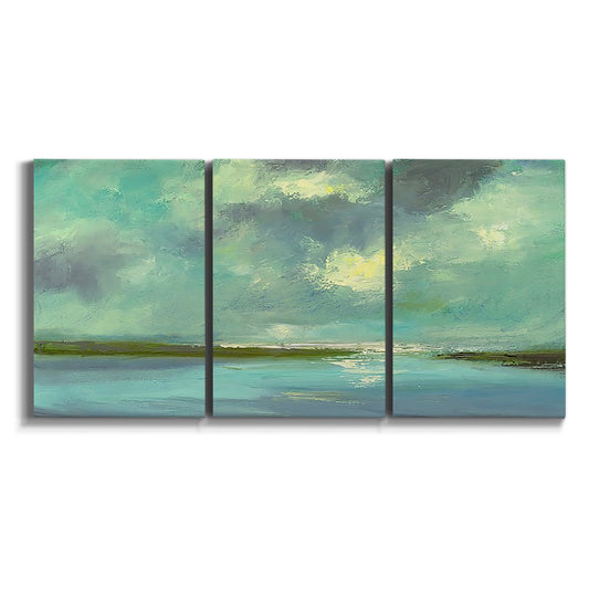 Three-panel canvas wall art featuring still lagoon water beneath open sky on white background.