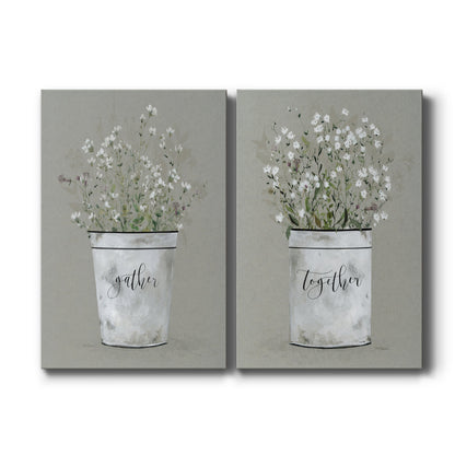 Set of two vertical canvas prints featuring rustic floral arrangement in bucket illustration, displayed side by side.
