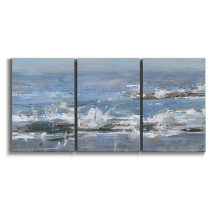 Three-panel canvas wall art featuring overcast coastal waves under grey sky on white background.