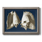 Vintage conch shell illustration on navy background printed on canvas in an ornate vintage silver frame.