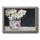 Contemporary floral watercolor with white flowers printed on canvas in an ornate vintage silver frame.