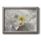 Neutral white peony photography printed on canvas in an ornate vintage silver frame.