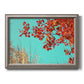 Red autumn leaves against a blue sky printed on canvas in an ornate vintage silver frame.