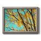 Bright autumn leaves against a blue sky printed on canvas in an ornate vintage silver frame.