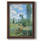 Impressionist pastoral landscape with poppy fields by Claude Monet printed on canvas in an ornate bronzed mahogany wood frame with a vertical orientation.