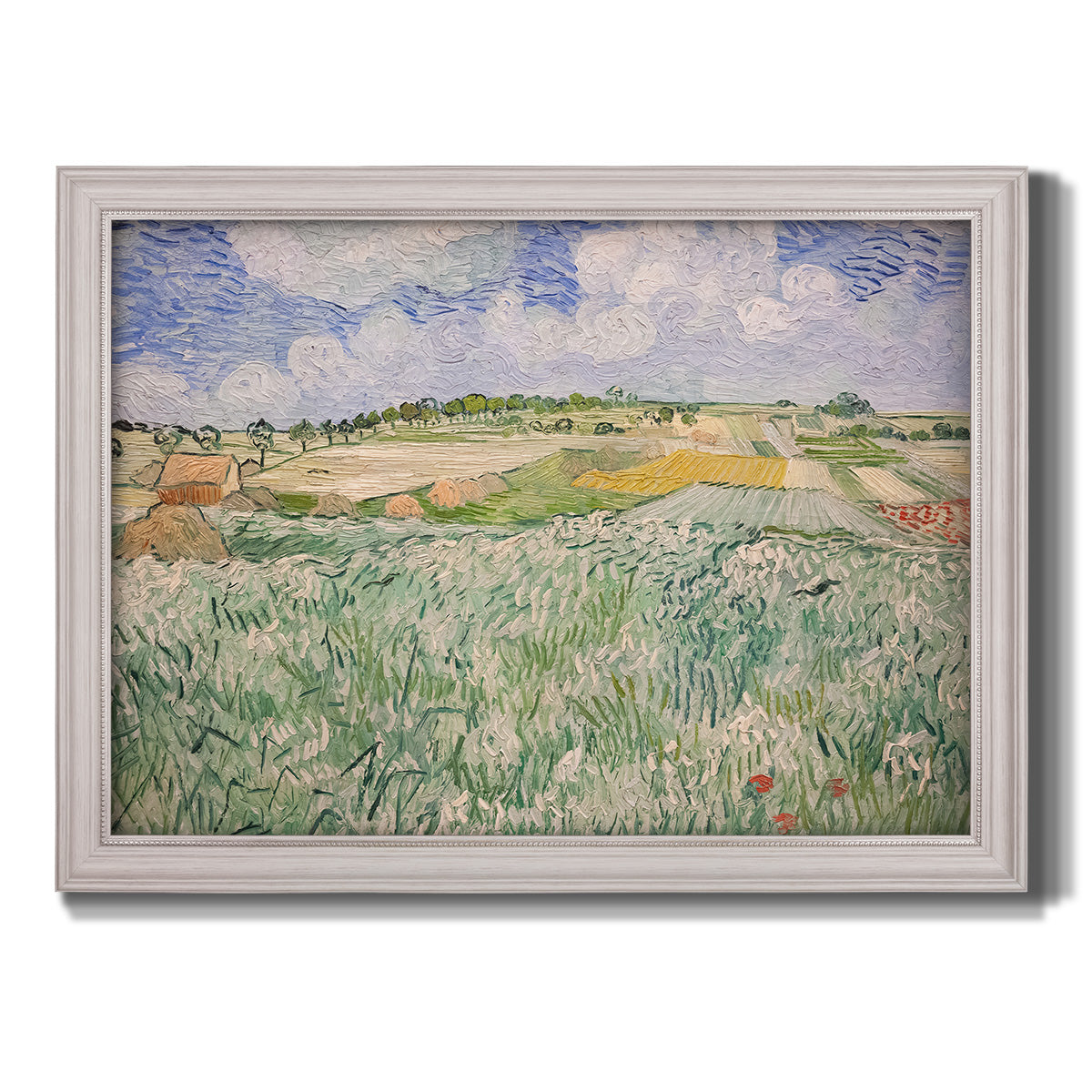Impressionist countryside landscape near Auvers by Vincent van Gogh printed on canvas in an ornate weathered white frame.