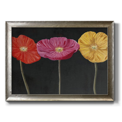 Contemporary poppy flower artwork printed on canvas in an ornate mottled silver frame.