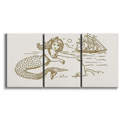 Three-panel canvas wall art featuring whimsical mermaid resting by sea on white background.