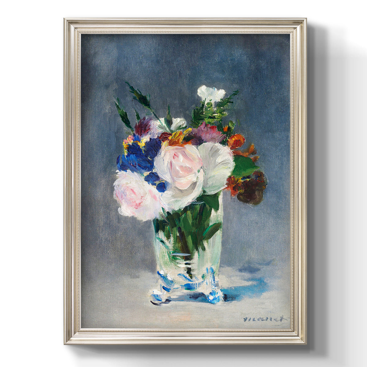 Impressionist floral still life painting by Claude Monet printed on canvas in an ornate black frame with gilded inner detail with a vertical orientation.