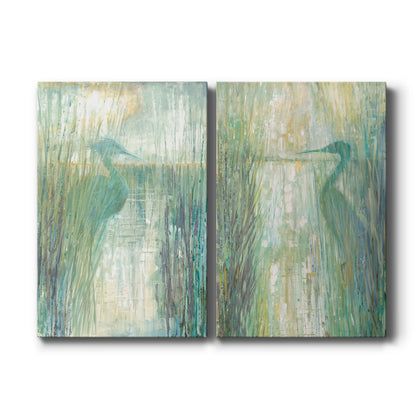 Set of two vertical canvas prints featuring serene egret bird in marsh landscape artwork, displayed side by side.