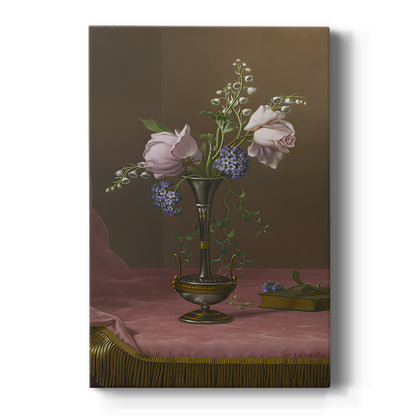 Canvas art print featuring a still life of mixed flowers in a decorative vase with soft light on a clean white background.