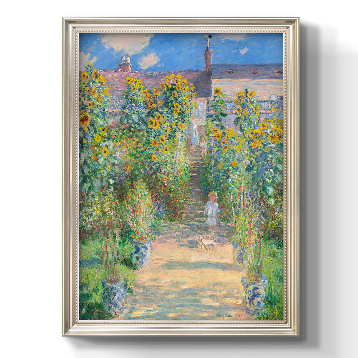 Impressionist garden landscape painting by Claude Monet printed on canvas in an ornate champagne frame with a vertical orientation.