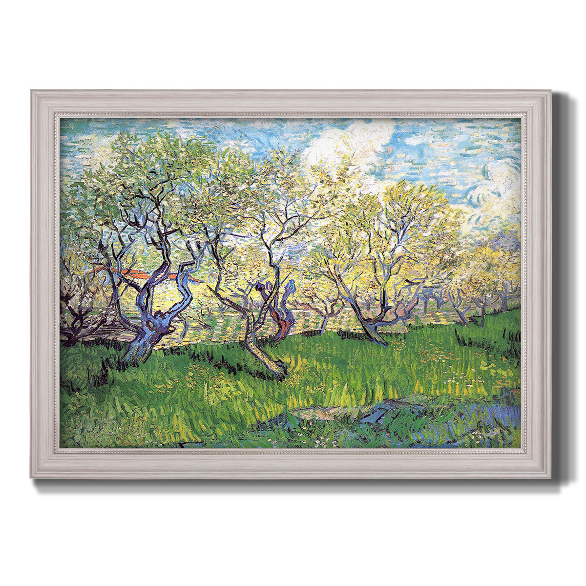 Impressionist spring orchard landscape by Vincent van Gogh printed on canvas in an ornate weathered white frame.