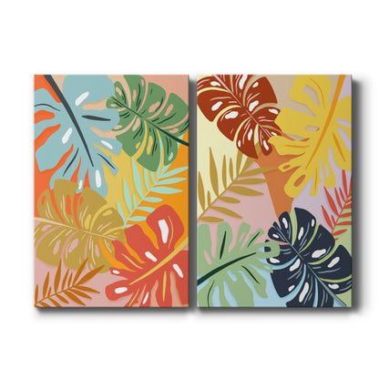 Set of two vertical canvas prints featuring bold abstract tropical leaf artwork, displayed side by side.