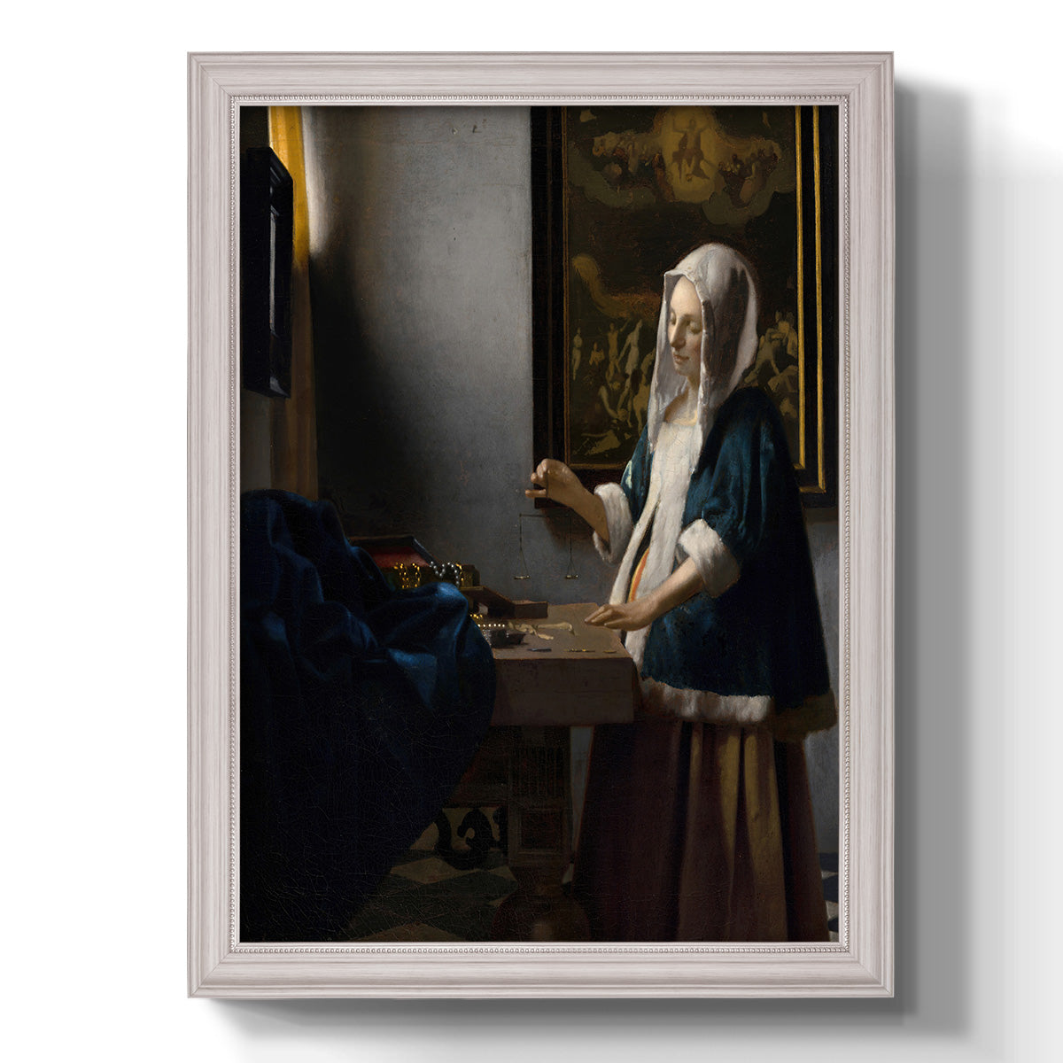 Quiet interior genre scene of a woman with scales by Johannes Vermeer printed on canvas in an ornate weathered white frame with a vertical orientation.