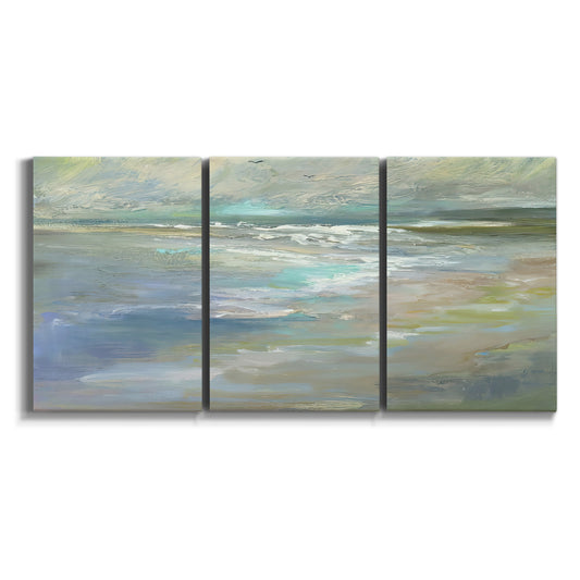 Three-panel canvas wall art featuring soft coastal beach light landscape on white background.