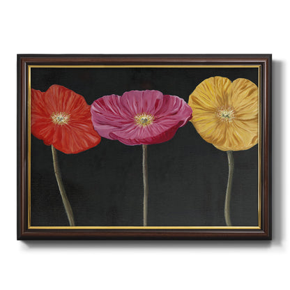 Contemporary poppy flower artwork printed on canvas in an ornate mahogany wood frame with gold liner.