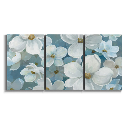 Three-panel canvas wall art featuring soft white floral abstraction on white background.