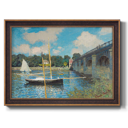 Impressionist river bridge scene at Argenteuil by Claude Monet printed on canvas in an ornate bronzed mahogany wood frame.
