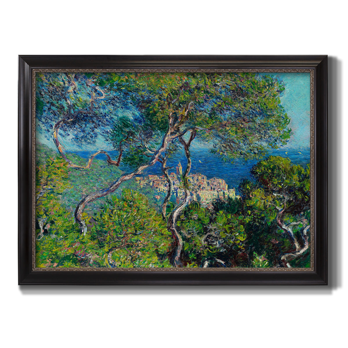 Impressionist Mediterranean coastal landscape by Claude Monet printed on canvas in an ornate black frame with gilded inner detail.