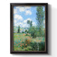 Impressionist pastoral landscape with poppy fields by Claude Monet printed on canvas in an ornate black frame with gilded inner detail with a vertical orientation.