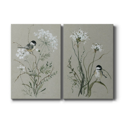 Set of two vertical canvas prints featuring delicate bird and floral botanical illustration, displayed side by side.