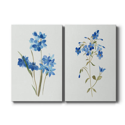 Set of two vertical canvas prints featuring blue blossom floral botanical illustration, displayed side by side.