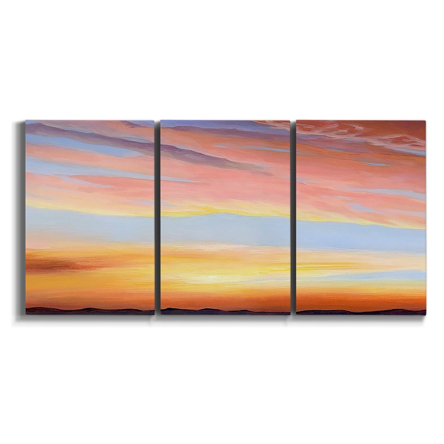 Three-panel canvas wall art featuring glowing sunset sky over landscape on white background.