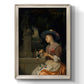 Classical interior scene of a woman weaving flowers by Godfried Schalcken printed on canvas in an ornate champagne frame with a vertical orientation.