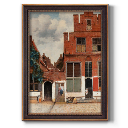 Realist city street scene by Johannes Vermeer printed on canvas in an ornate bronzed mahogany wood frame with a vertical orientation.