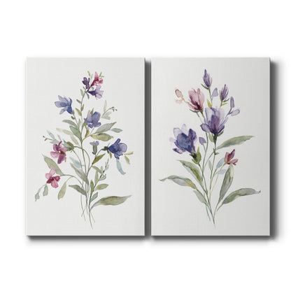 Set of two vertical canvas prints featuring soft pastel wildflower botanical illustration, displayed side by side.