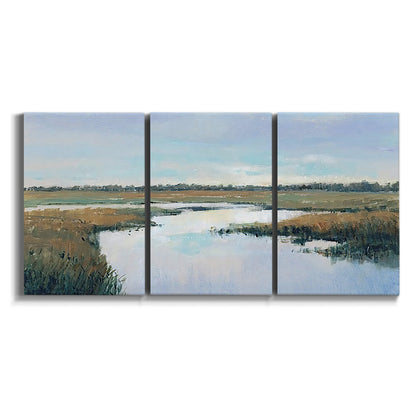 Three-panel canvas wall art featuring coastal plain meeting open water on white background.