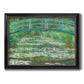 Impressionist garden scene with Japanese bridge and water lilies by Claude Monet printed on canvas in an ornate black frame with gilded inner detail.