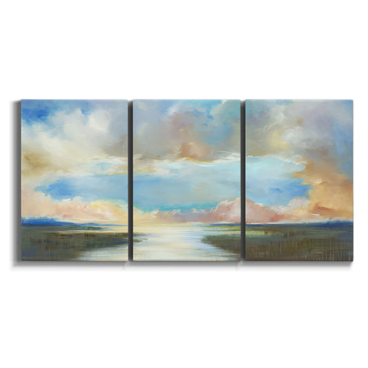 Three-panel canvas wall art featuring dawn light breaking over water on white background.