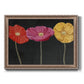 Contemporary poppy flower artwork printed on canvas in an ornate traditional silver frame.