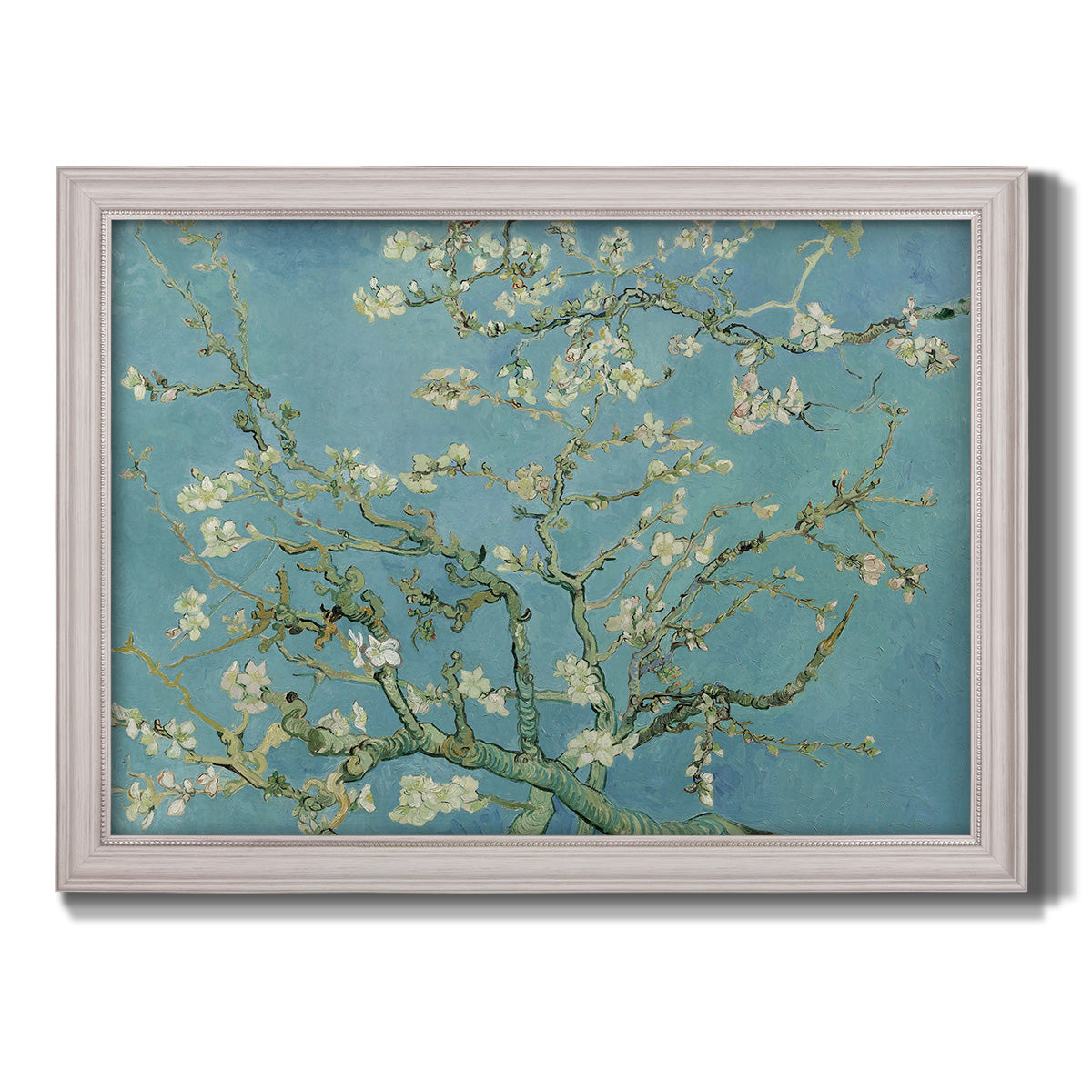 Impressionist flowering almond branch painting by Vincent van Gogh printed on canvas in an ornate weathered white frame.