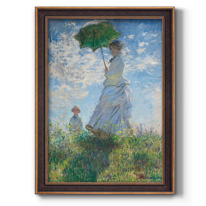 Impressionist portrait of a woman with a parasol by Claude Monet printed on canvas in an ornate bronzed mahogany wood frame with a vertical orientation.
