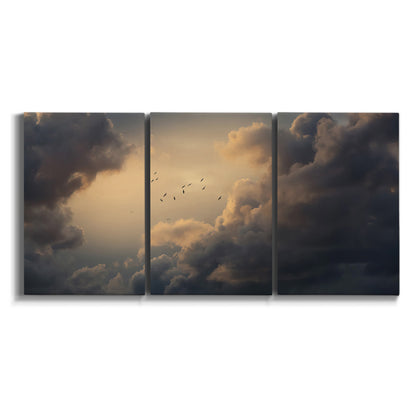 Three-panel canvas wall art featuring surreal floating figures above landscape on white background.