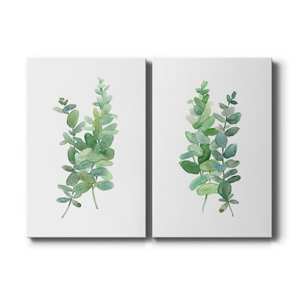 Set of two vertical canvas prints featuring green eucalyptus branch botanical illustration, displayed side by side.