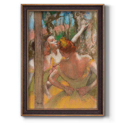 Impressionist ballet dancer composition by Edgar Degas printed on canvas in an ornate weathered white frame with a vertical orientation.
