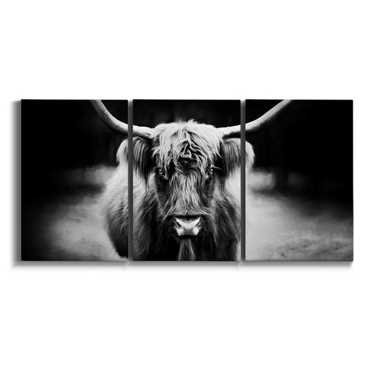 Three-panel canvas wall art featuring black and white cattle portrait on white background.
