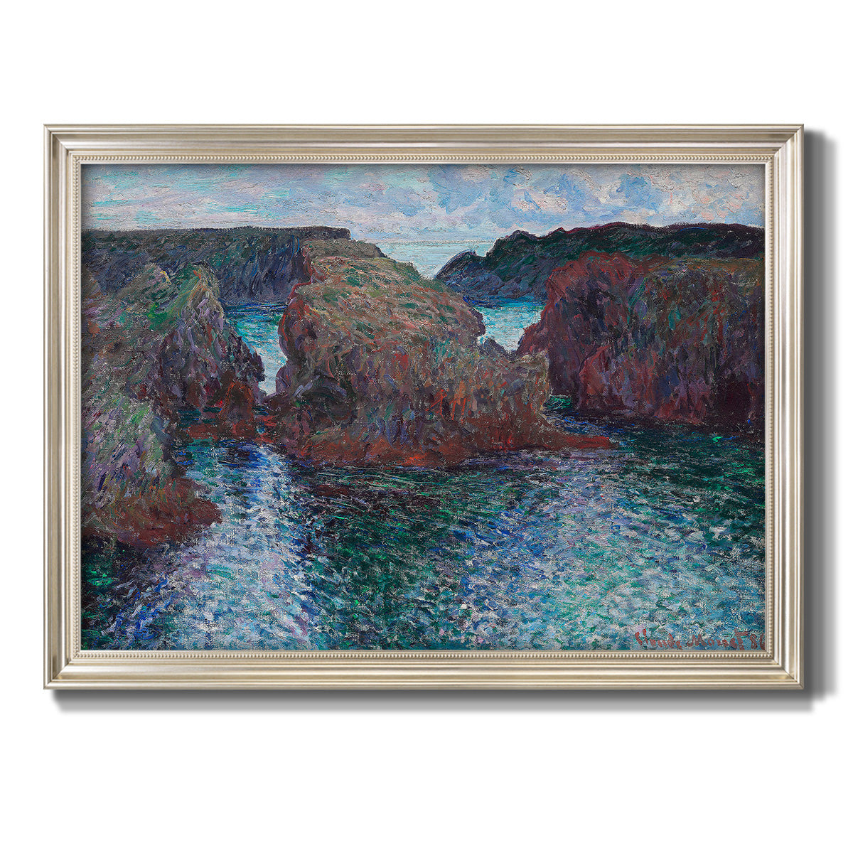 Impressionist rocky seascape by Claude Monet printed on canvas in an ornate champagne frame.