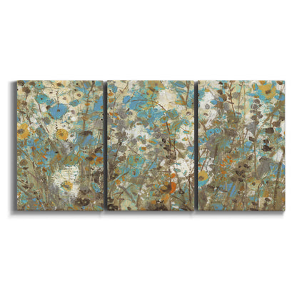 Three-panel canvas wall art featuring abstract flowering vine pattern on white background.