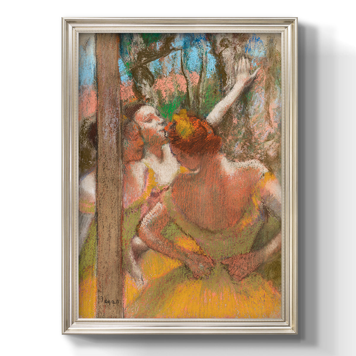 Impressionist ballet dancer composition by Edgar Degas printed on canvas in an ornate black frame with gilded inner detail with a vertical orientation.