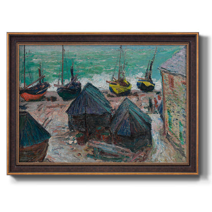 Impressionist coastal beach scene with boats by Claude Monet printed on canvas in an ornate bronzed mahogany wood frame.
