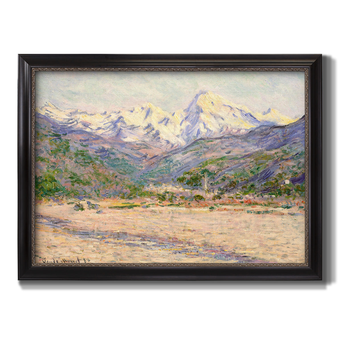 Impressionist valley landscape in southern France by Claude Monet printed on canvas in an ornate black frame with gilded inner detail.