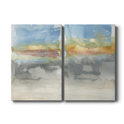Set of two vertical canvas prints featuring warm desert sunset landscape artwork, displayed side by side.